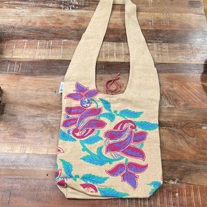 UNICEF hand painted across body bag